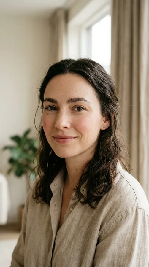 Woman wearing a comfortable, well-fitted neutral outfit for a polished photo.